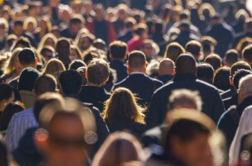 Crowd of people walking street