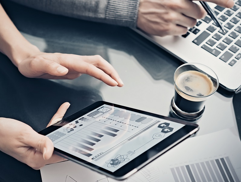 Analytical department working process.Closeup woman showing business reports modern