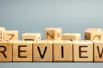 Wooden blocks with the word Review. Customer review concept. Reviewing, auditing, reviewer. Service rating. Feedback.