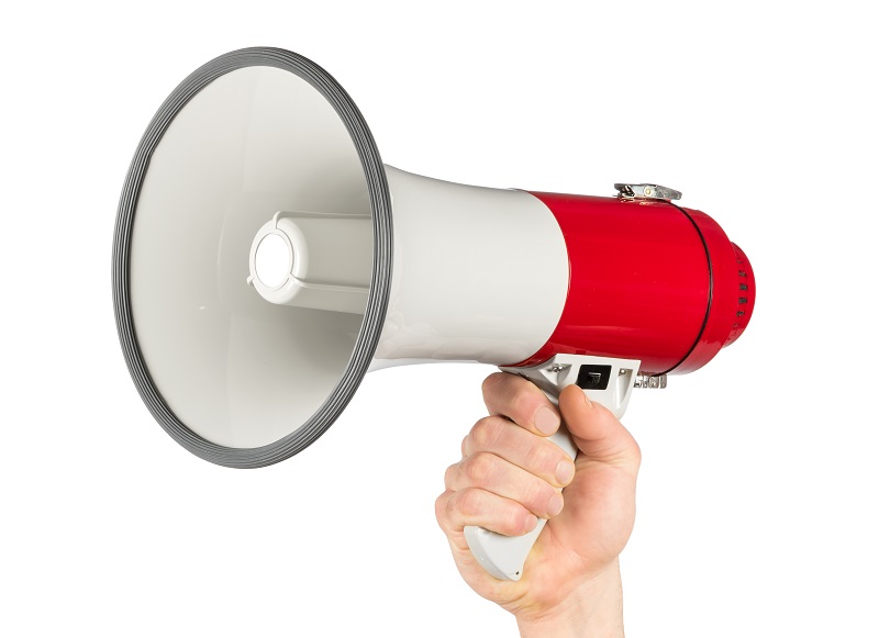hand with red gray megaphone bullhorn isolated on white background