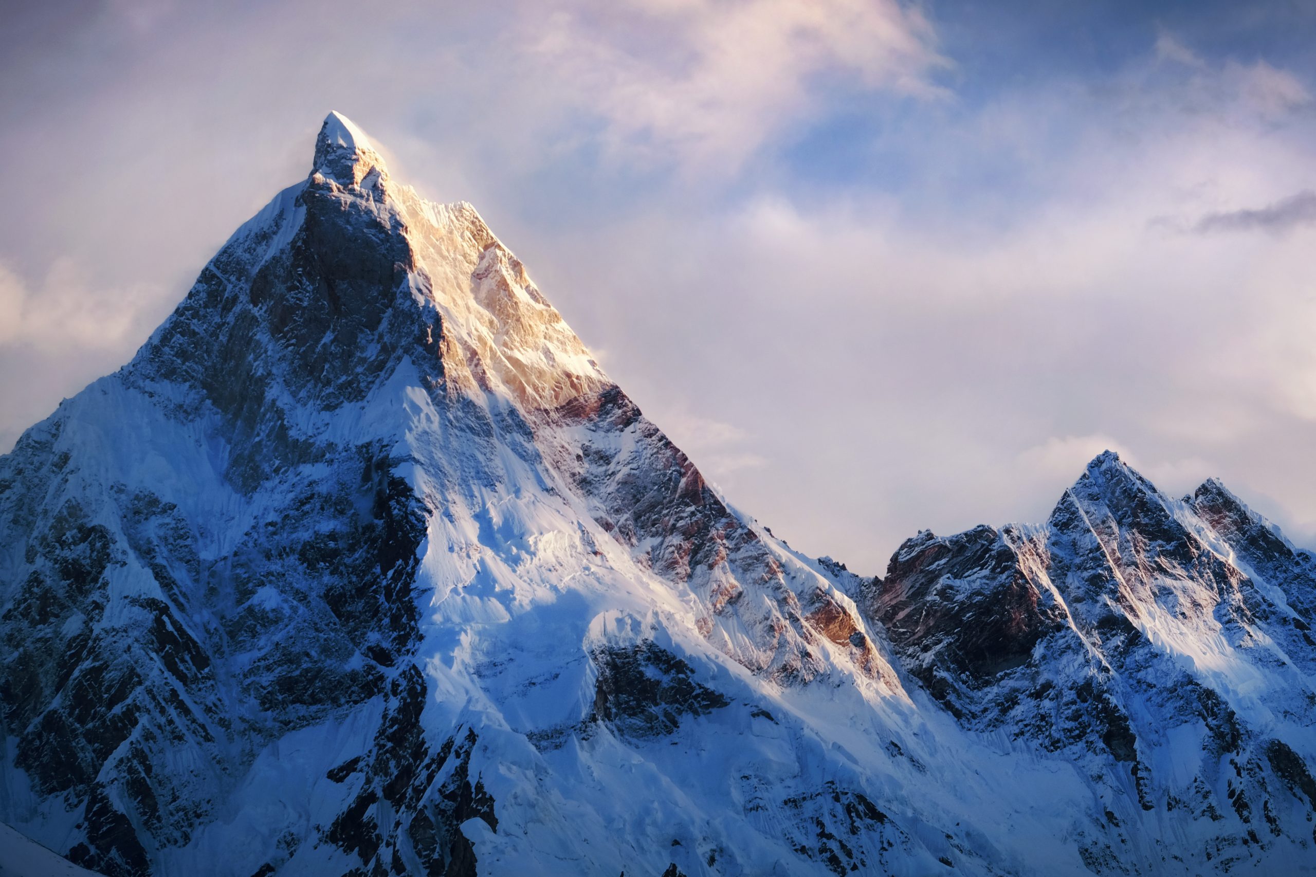 Panoramic view of beautiful snowy Masherbrum peak in Karakoram mountain range during sunset light