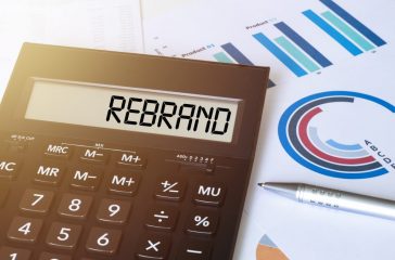 Word REBRAND on calculator. Business and finance concept.