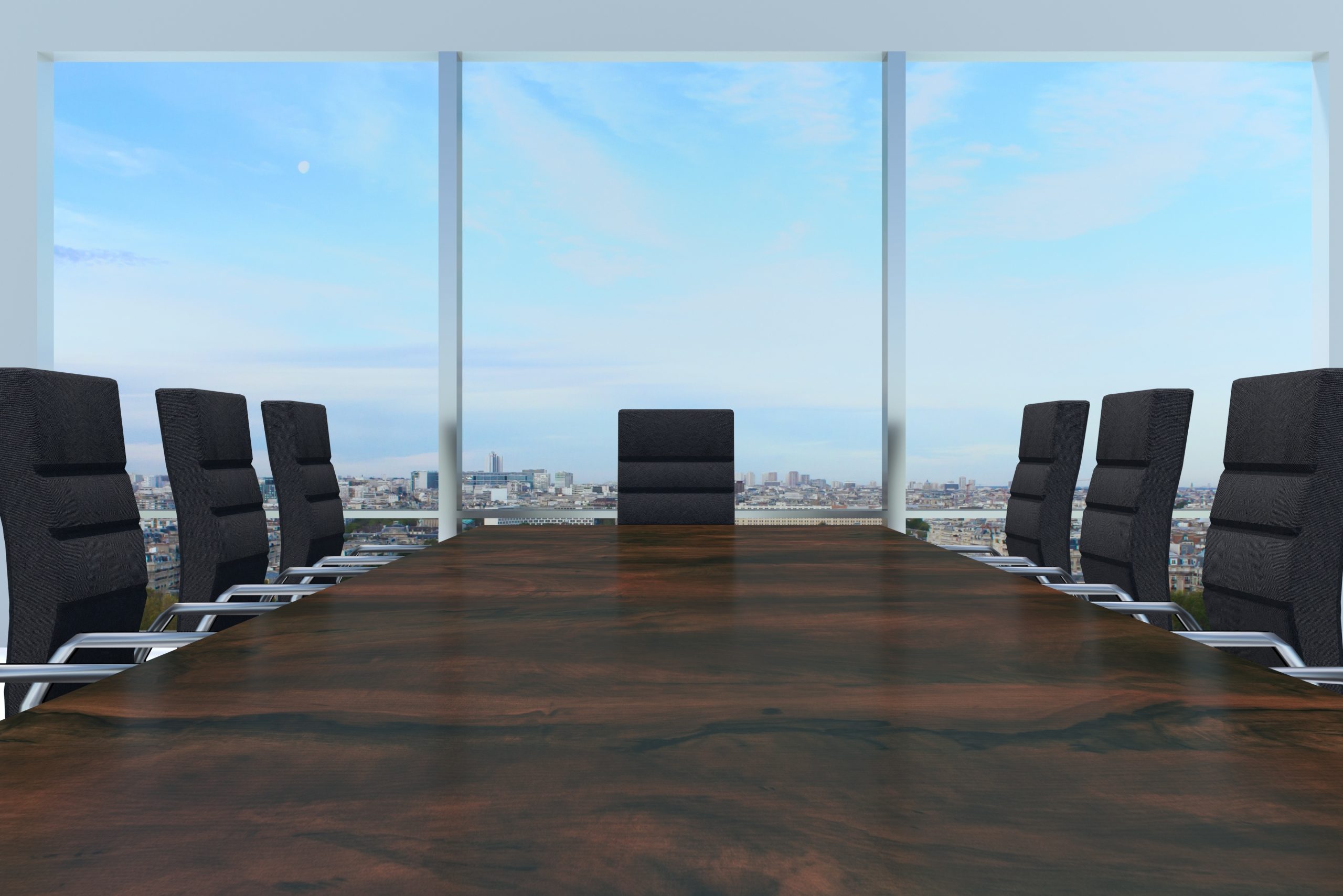 conference room with large wooden desk and skyline window