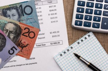 Statement of account with australian dollar, calculator and notepad