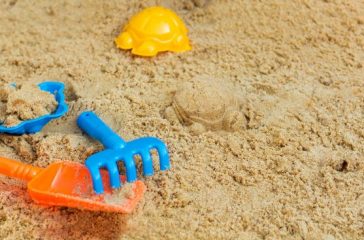 child playing in the sandbox