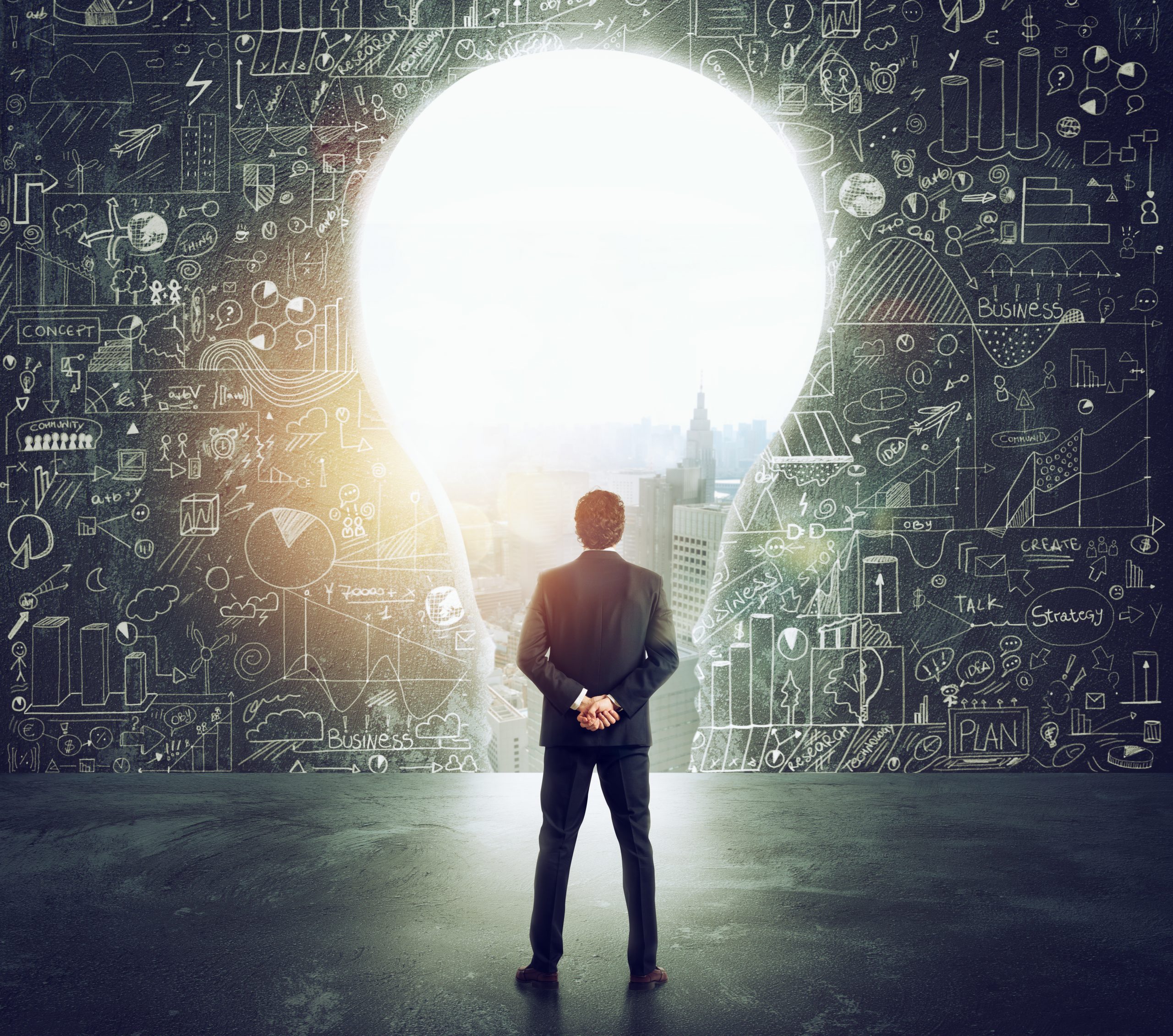 Businessman looks at a big hole on the wall shaped as a light bulb