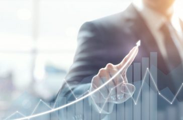 Development and growth concept. Businessman plan growth and increase of positive indicators in his business.