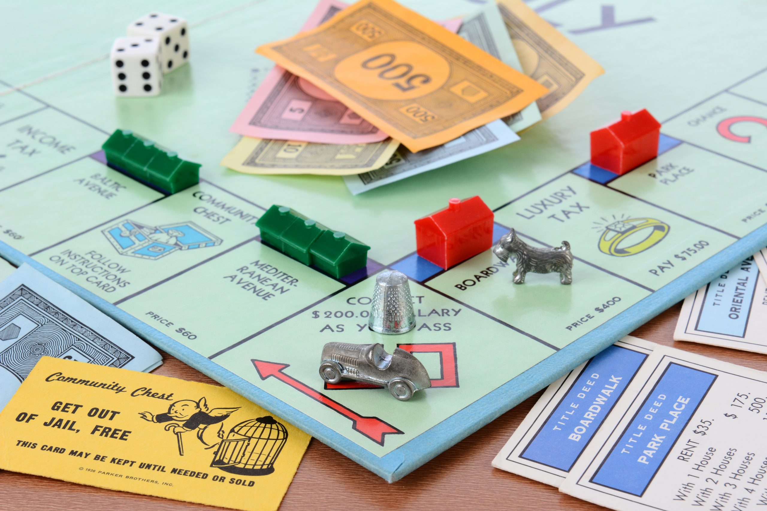IRVINE, CA - May 19, 2014: Monopoly Board Game Closeup. The classic real estate trading game from Parker Brothers was first introduced to America in 1935.