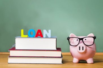 Student loan theme with textbooks and piggy bank
