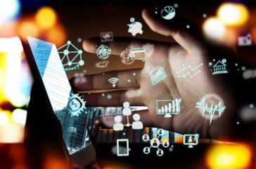 Fintech Investment Financial Technology Concept. P2P Payment concept image.Startup and crowd funding concept.Social network with P2P lending. Smart phone with technology icons coming out