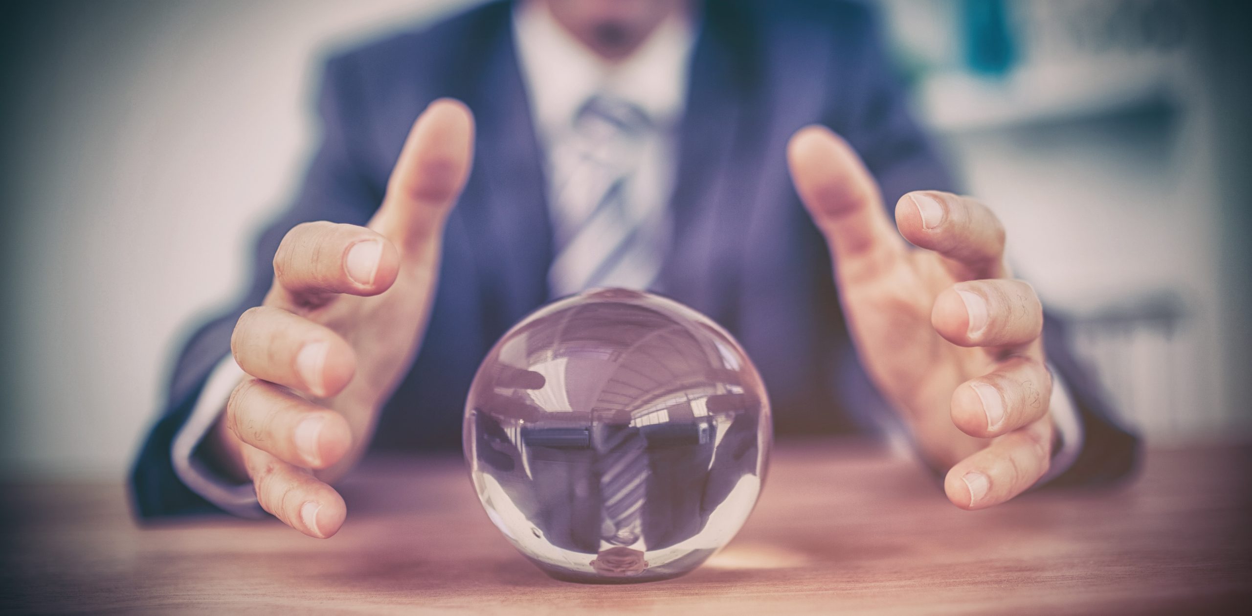 Businessman forecasting a crystal ball