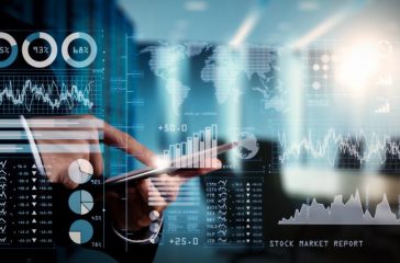 Investor analyzing stock market report and financial dashboard with business intelligence (BI), with key performance indicators (KPI).businessman hand working with finances program.