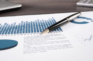 business background. financial report on the table at the businessman
