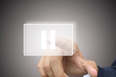 Business hand press pause button