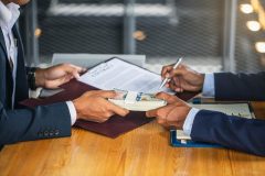 Customer signing contract documents for realty purchase, Bank employees congratulate, Concept mortgage loan approval. Business loan from a bank employee. finance concept .