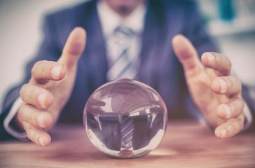 Businessman forecasting a crystal ball