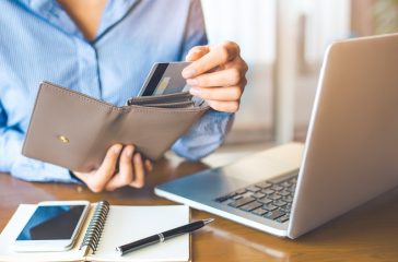 Person taking card out of wallet