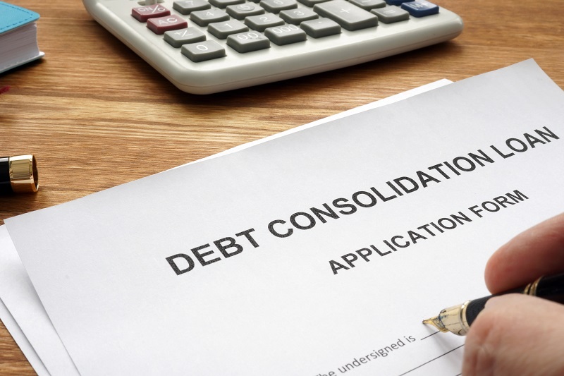 Man filling in Debt consolidation loan application.