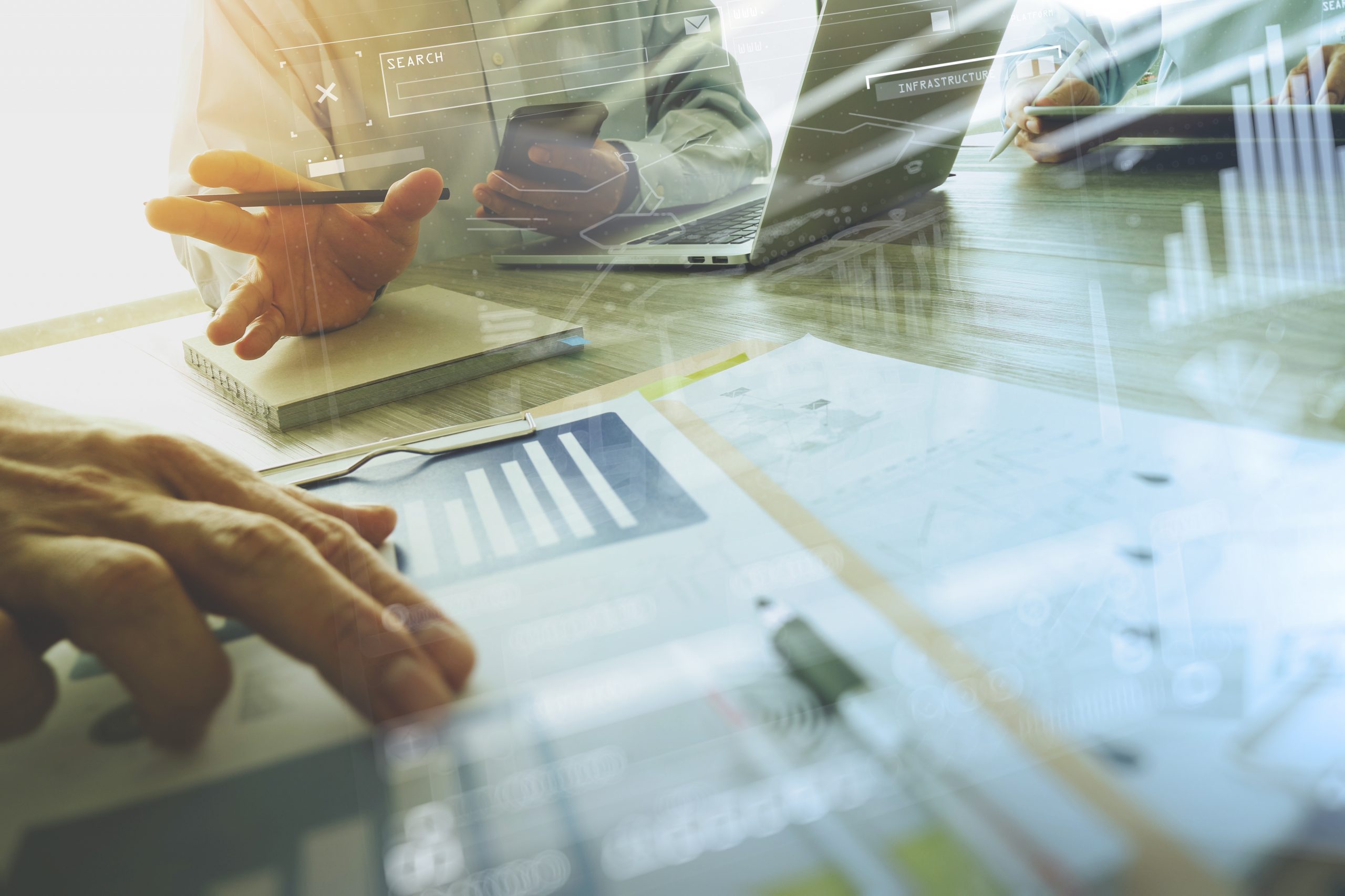 business documents on office table with smart phone and laptop c