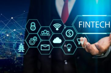 Fintech (financial technology) concept. Business person hold fintech illustration and icon technology.5G network wireless systems.IoT(Internet of Things), ICT,communication network concept.