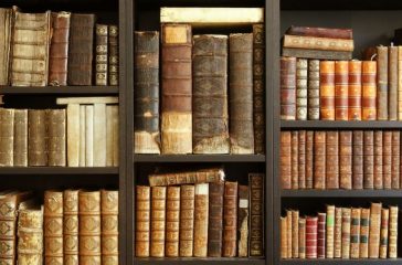 old books on wooden shelf