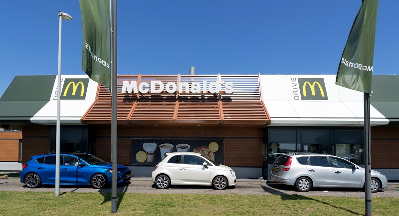 HOOFDDORP, THE NETHERLANDS - JUNE 28, 2019: McDonald’s McDrive drive-through service.  McDonald’s is an American hamburger and fast food restaurant chain, founded in 1940.