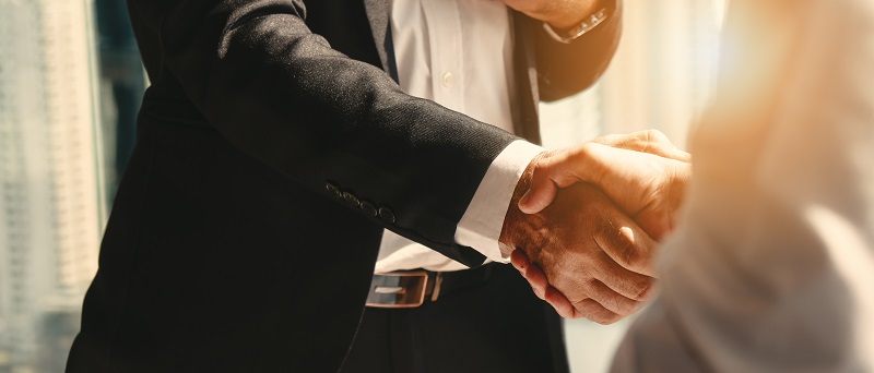 businessman handshake for teamwork of business merger and acquisition