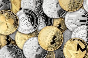 cryptocurrency background banner huge stack of different silver and golden crypto coins bitcoin ethereum ripple monero dash iota litecoin