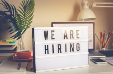 We are hiring text on light box on desk office