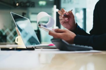 Business man analyzing investment graph and discussing plan in meeting room, investment concept