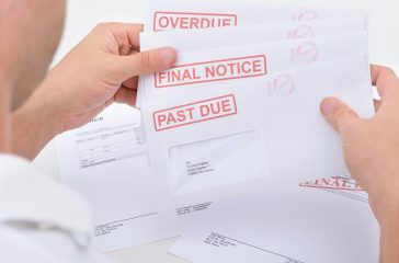 Man Holding Legal Notices
