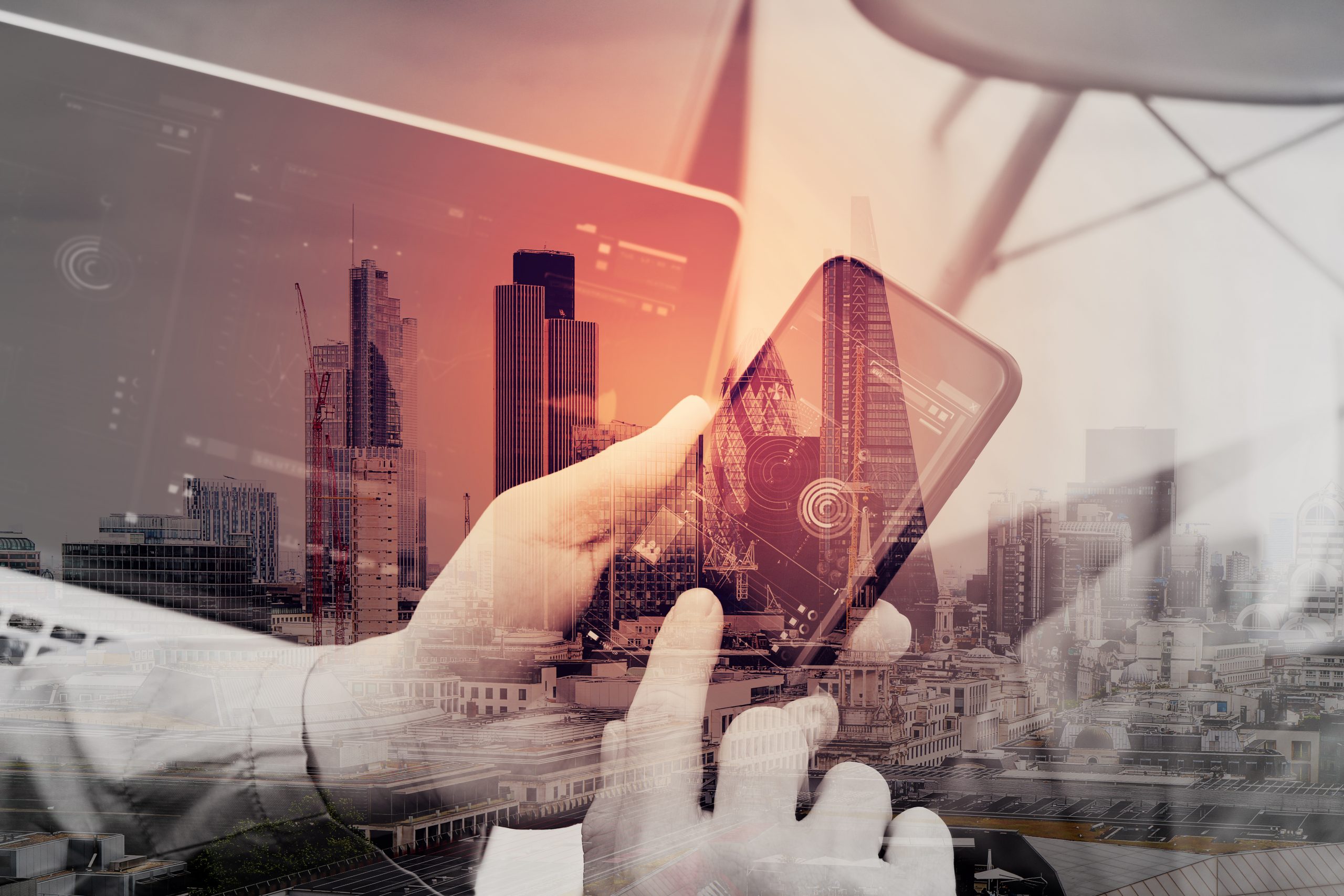 Double exposure of hand using smart phone and digital tablet computer for online banking payment communication in modern office with London city