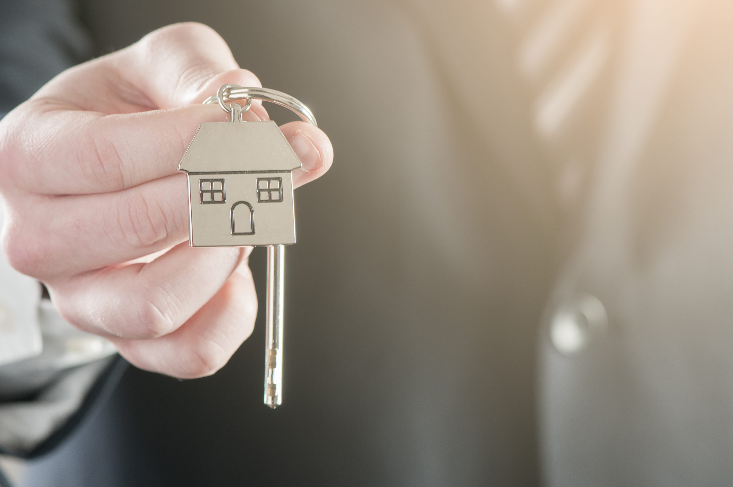 Hand with a house key