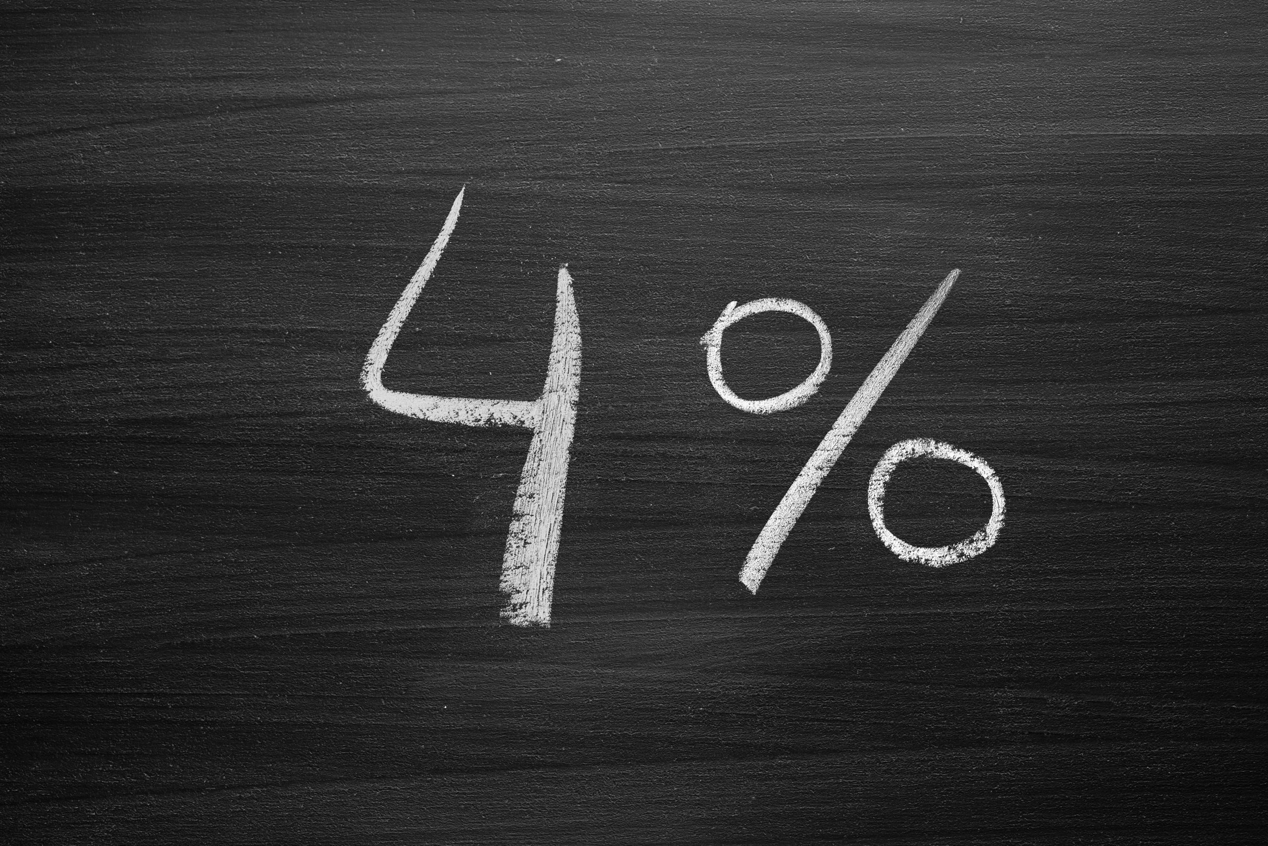 four percent header written with a chalk on the blackboard four percent header written with a chalk on the blackboard