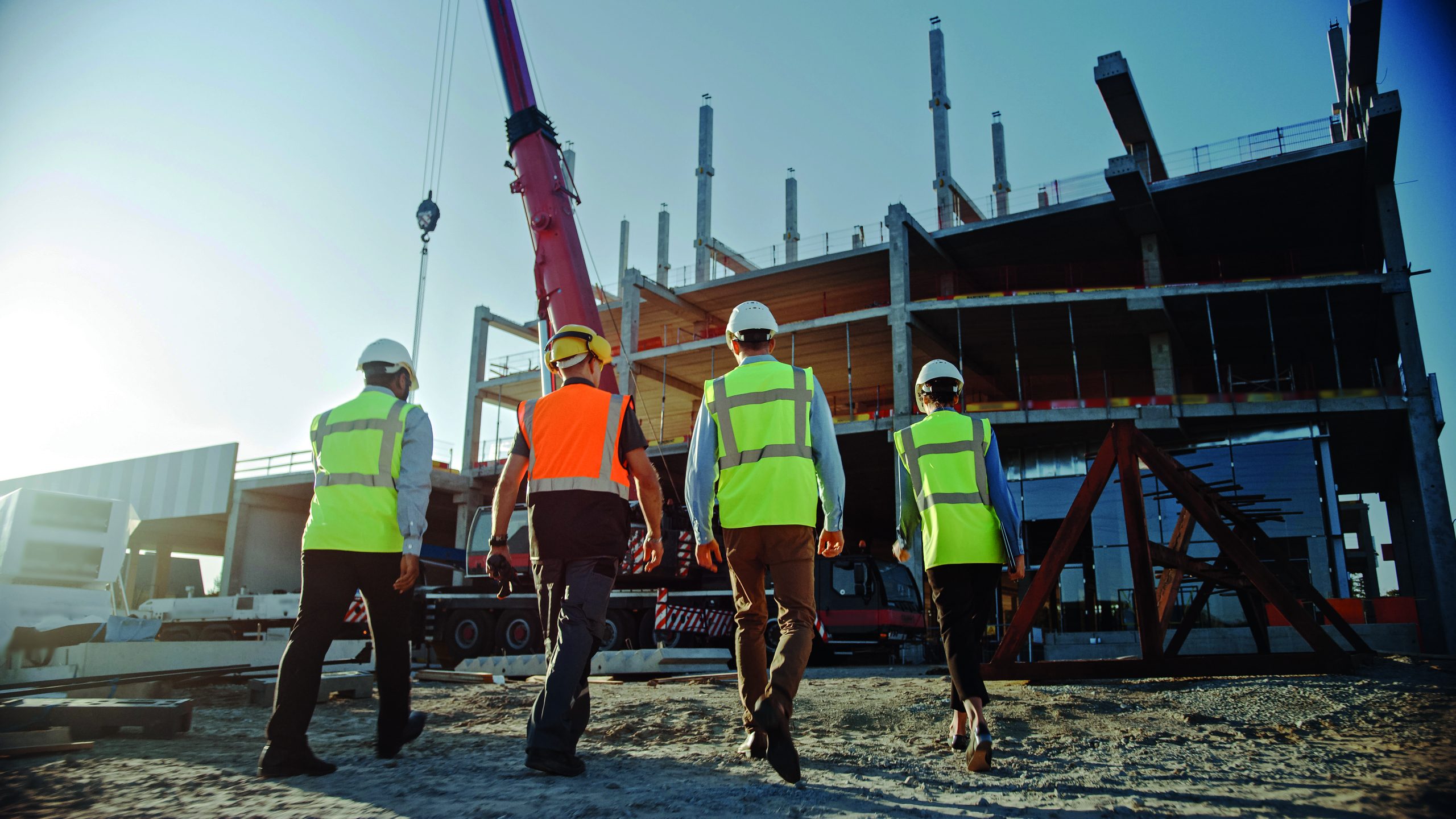 Diverse Team of Specialists Inspect Commercial, Industrial Build