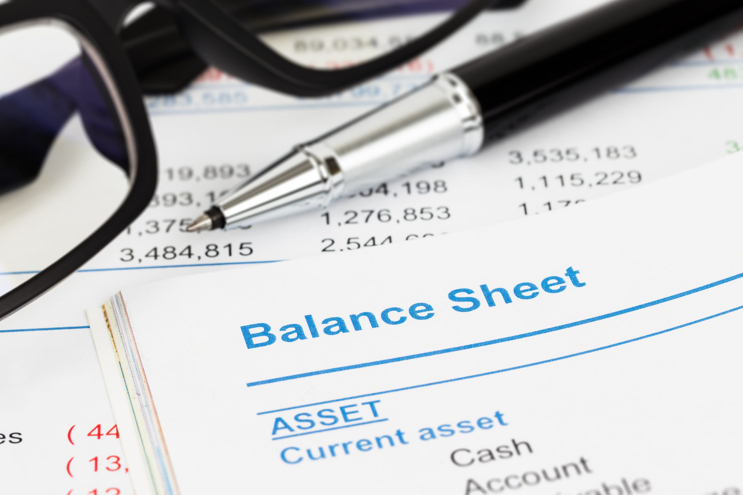 Balance sheet in stockholder report book, balance sheet is mock-
