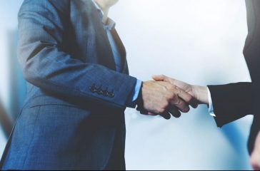 businessmen handshake - business meeting and partnership concept