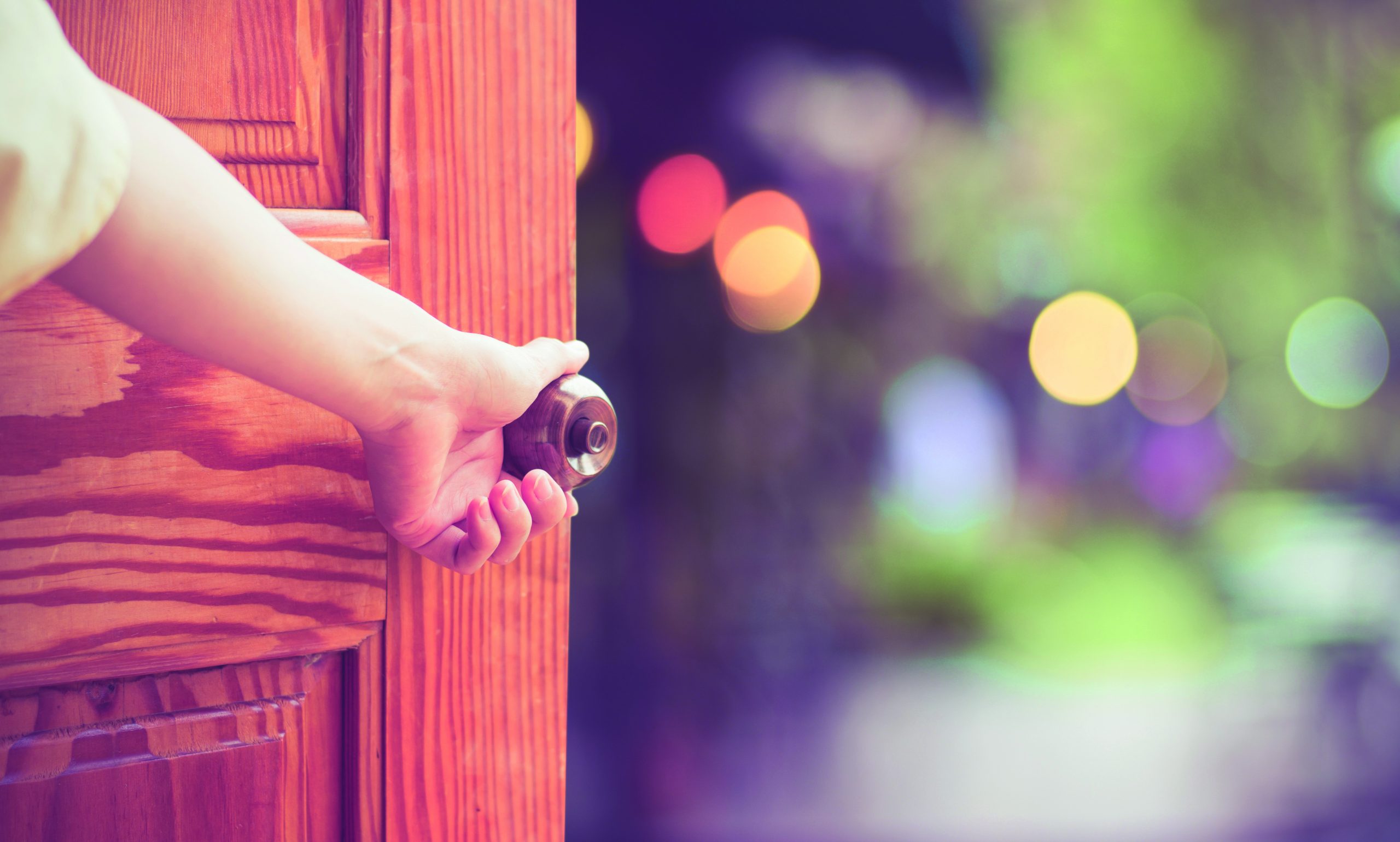 Women hand open door knob or opening the door.