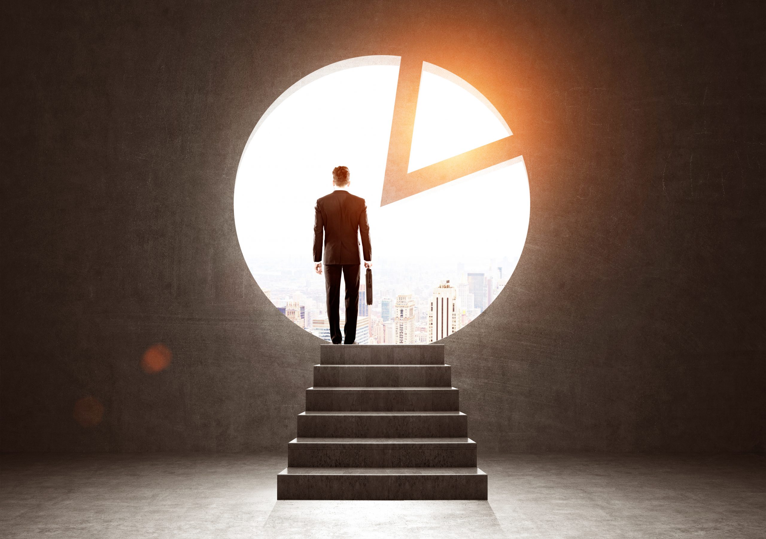 Man exiting through a pie diagram in a wall Man exiting through a pie diagram in a wall
