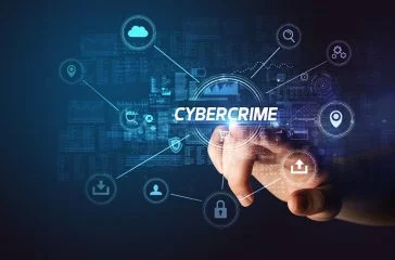 Hand touching cybersecurity button