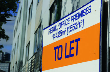 To let sign on building angled side picture