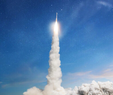 Space rocket lift off with starts a space mission in the blue sky. Spaceship with blast and smoke launch into space. Fly to the moon