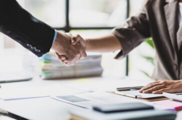 Handshake, Business cooperation at a meeting of business people. Business partners shaking hands in a meeting.