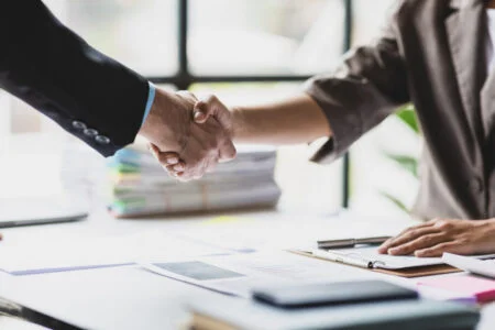 Handshake, Business cooperation at a meeting of business people. Business partners shaking hands in a meeting.